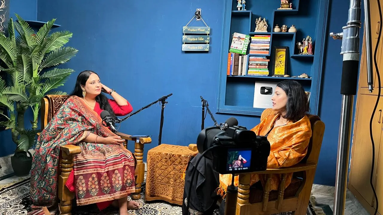 Podcast recording studio with female host in control room